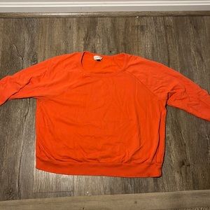 Orange long sleeved top